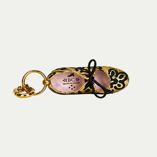 Charm fantasia oro y negro